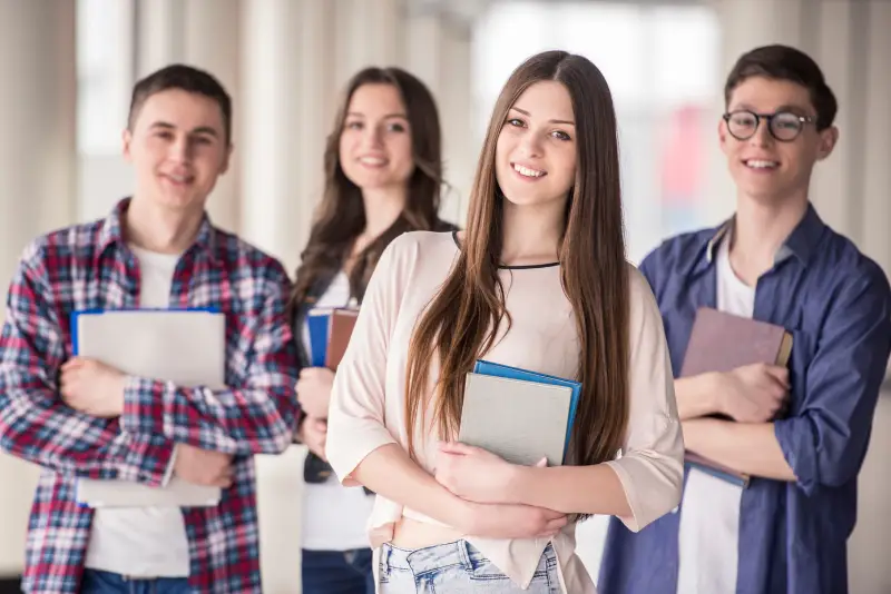 group of happy teen high school students 